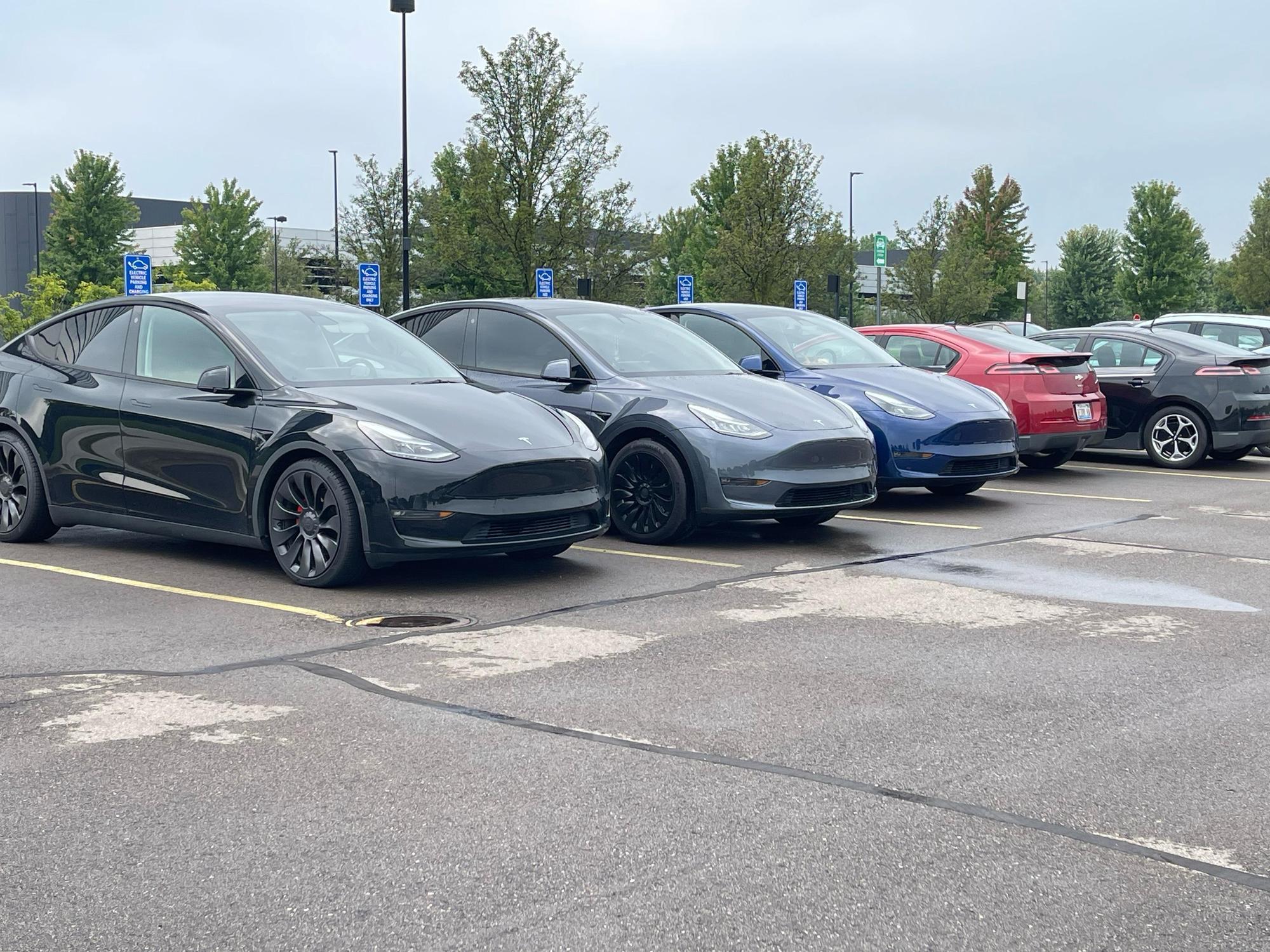 Row of EVs charging at Aptiv's Innovation Drive campus — multiple Level 2 stations available