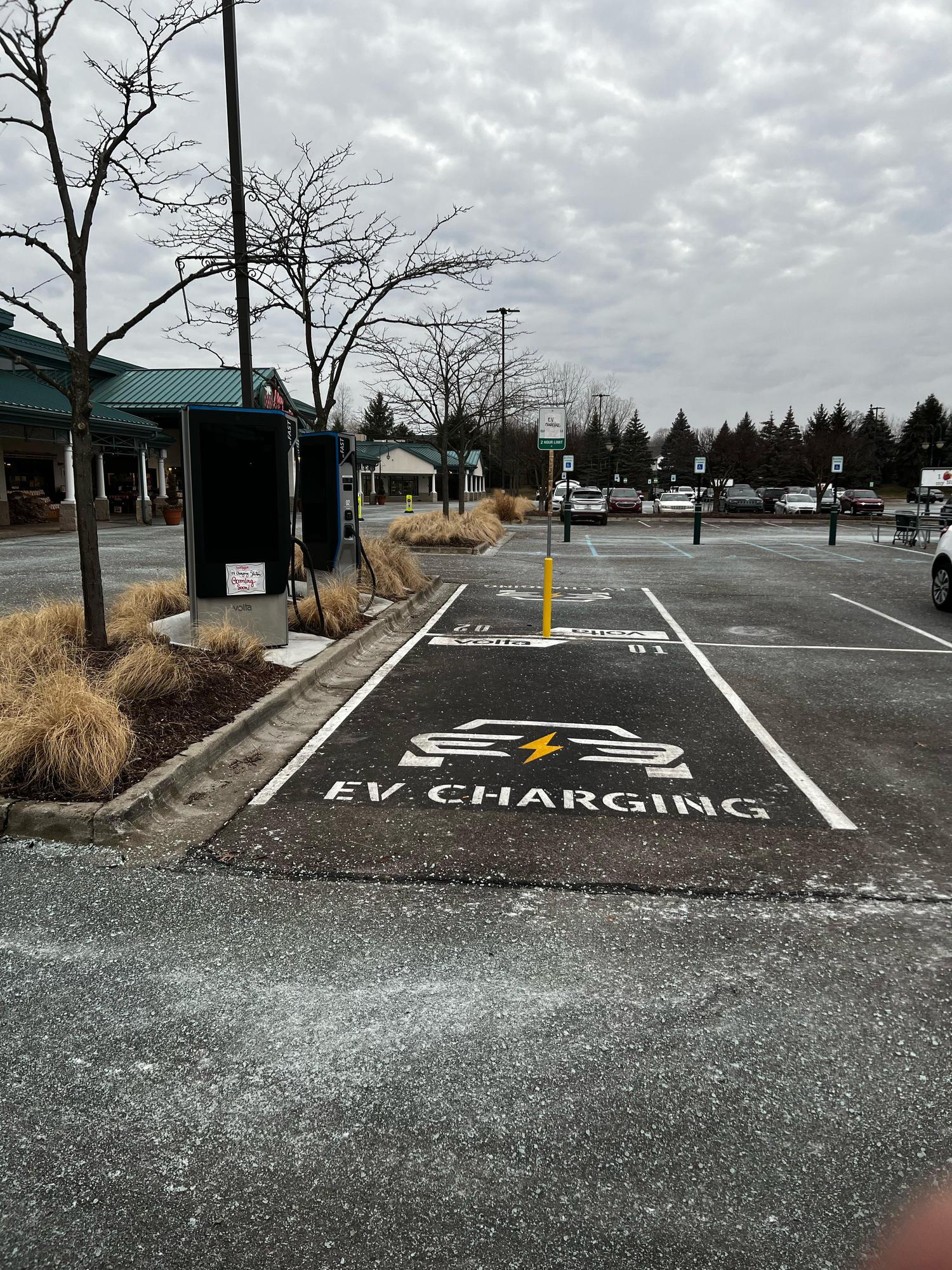 DC fast charger with dedicated EV Charging parking spots in the southeast corner of the lot
